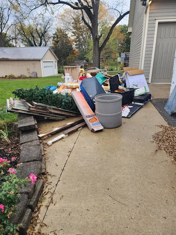 Dumpster being loaded with debris for 12 Yard Dumpster Rental in Mount Vernon
